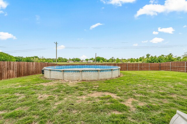 view of yard featuring a fenced backyard and a fenced in pool