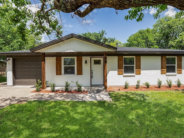 ranch-style home with concrete driveway, covered porch, a front yard, an attached garage, and brick siding