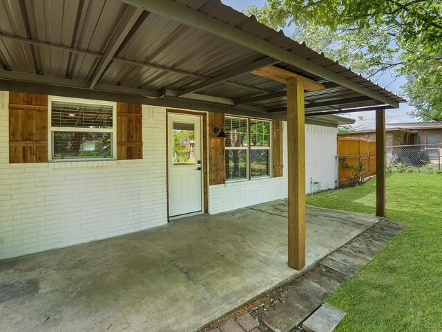view of patio / terrace featuring fence