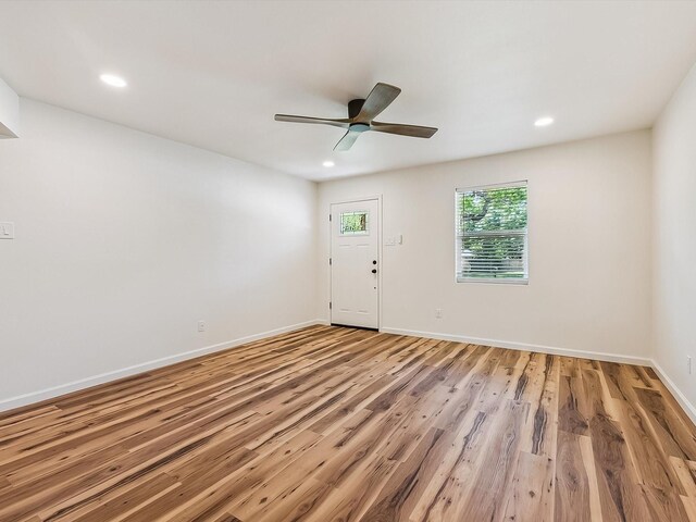 ranch-style house with a front yard, driveway, and an attached garage