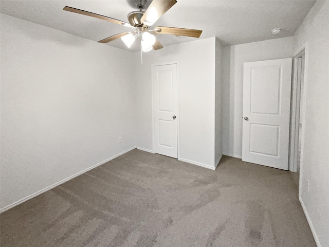 6267 Unbridled Dr, Forney, TX 75126 - unfurnished bedroom featuring carpet floors, baseboards, and a ceiling fan