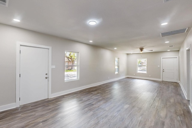 1500 W Collin, Corsicana, TX 75110 - unfurnished living room featuring wood finished floors, healthy amount of natural light, a ceiling fan, and recessed lighting