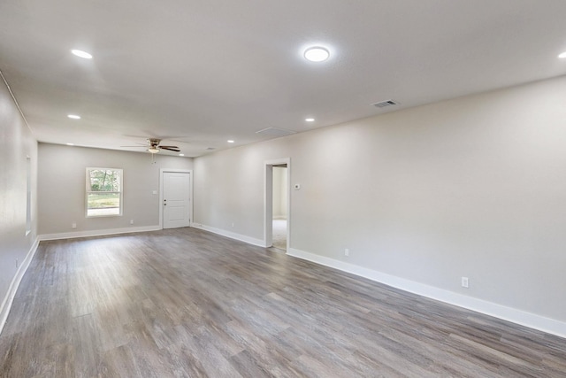 1500 W Collin, Corsicana, TX 75110 - spare room with wood finished floors, a ceiling fan, baseboards, and recessed lighting