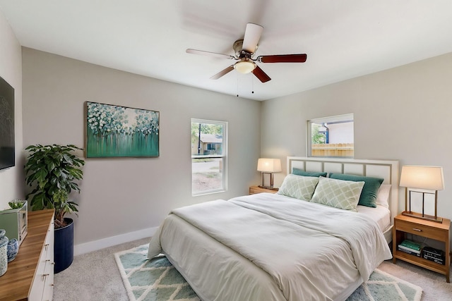 1500 W Collin, Corsicana, TX 75110 - bedroom with carpet, multiple windows, baseboards, and a ceiling fan