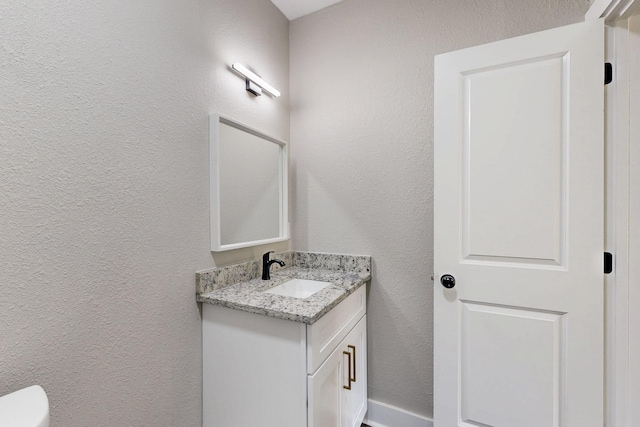 1500 W Collin, Corsicana, TX 75110 - half bath with vanity, a textured wall, and toilet