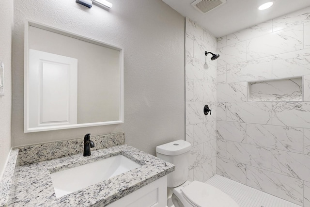 1500 W Collin, Corsicana, TX 75110 - bathroom featuring vanity, toilet, and tiled shower