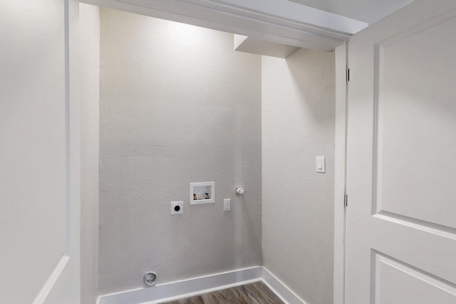 1500 W Collin, Corsicana, TX 75110 - laundry area with washer hookup, dark wood finished floors, electric dryer hookup, and baseboards