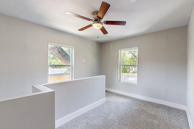1500 W Collin, Corsicana, TX 75110 - carpeted empty room featuring baseboards and a ceiling fan