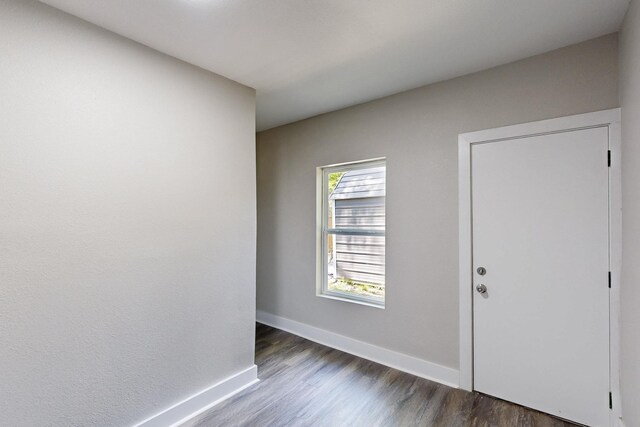 1500 W Collin, Corsicana, TX 75110 - empty room with dark wood finished floors and baseboards