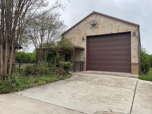 125 Rattling Antler Ct, Azle, TX 76020 - view of front of house featuring concrete driveway, fence, and stone siding
