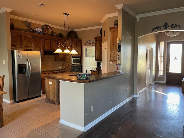 125 Rattling Antler Ct, Azle, TX 76020 - kitchen featuring crown molding, appliances with stainless steel finishes, a peninsula, decorative light fixtures, and visible vents