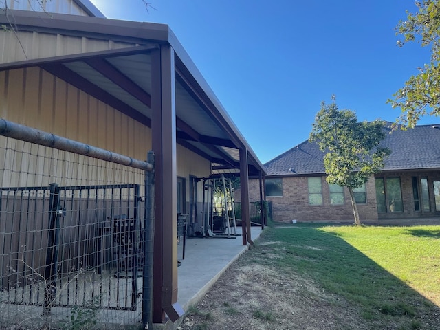 125 Rattling Antler Ct, Azle, TX 76020 - view of property exterior featuring fence, brick siding, a shingled roof, a patio area, and a lawn