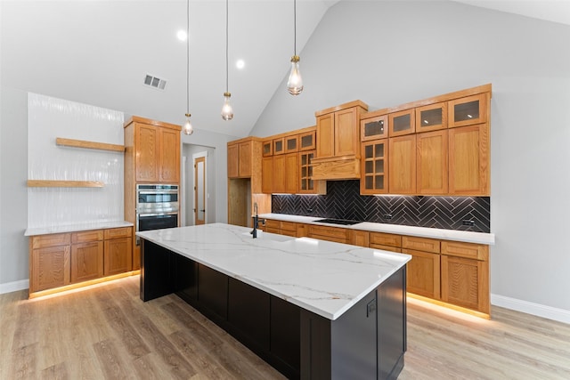 kitchen with decorative backsplash, stainless steel double oven, visible vents, open shelves, and light wood-style floors