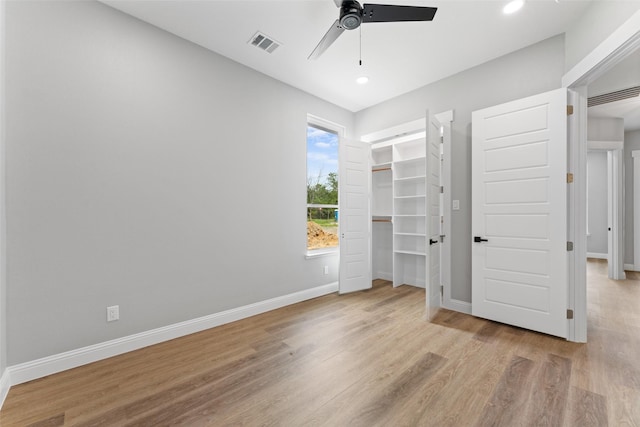 unfurnished bedroom with ceiling fan, recessed lighting, baseboards, wood finished floors, and visible vents