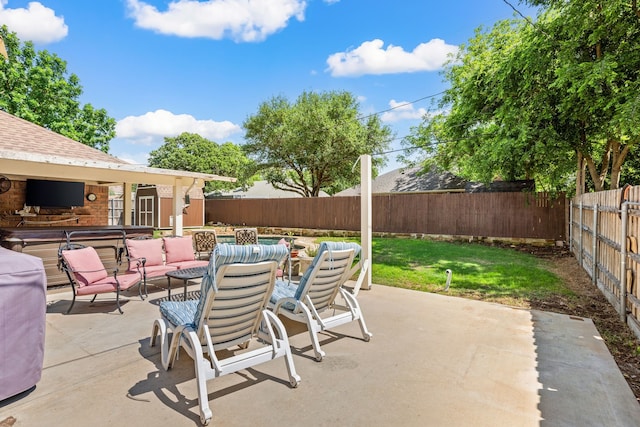 view of patio / terrace with a fenced backyard, outdoor dining space, and an outdoor living space