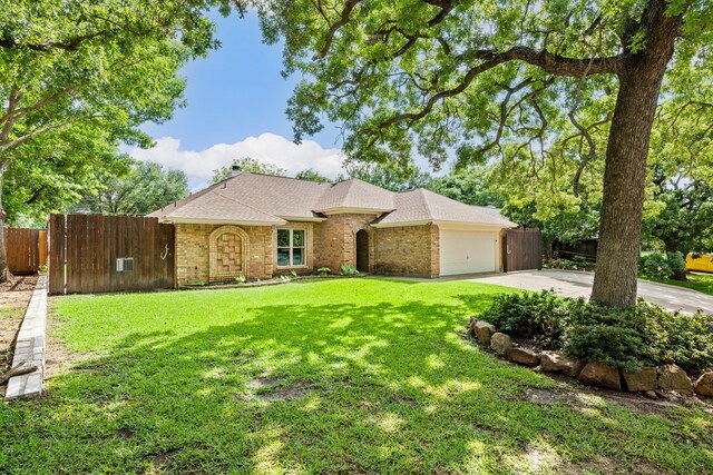 ranch-style home featuring brick siding, concrete driveway, a garage, and roof with shingles