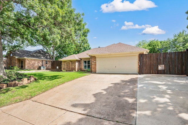 ranch-style house featuring an attached garage, brick siding, driveway, and roof with shingles