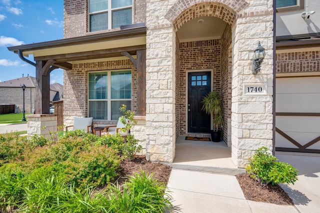 1740 Wassel Rd, Fort Worth, TX 76052 - doorway to property featuring stone siding, covered porch, and brick siding