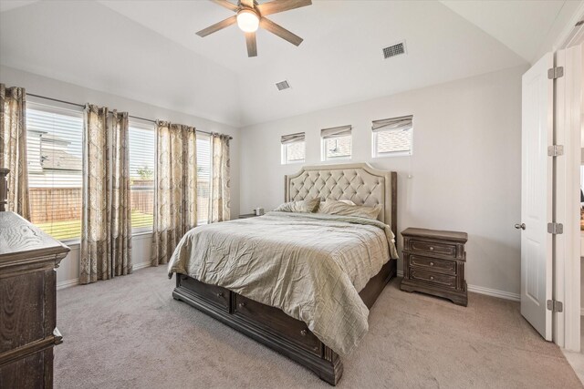 bedroom with lofted ceiling, light carpet, baseboards, and ceiling fan