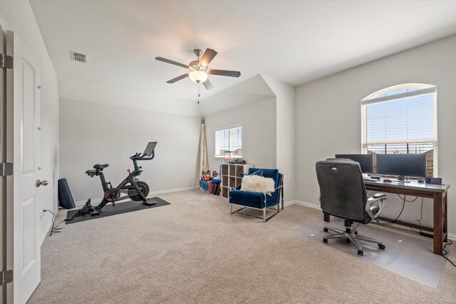 carpeted office featuring ceiling fan and baseboards