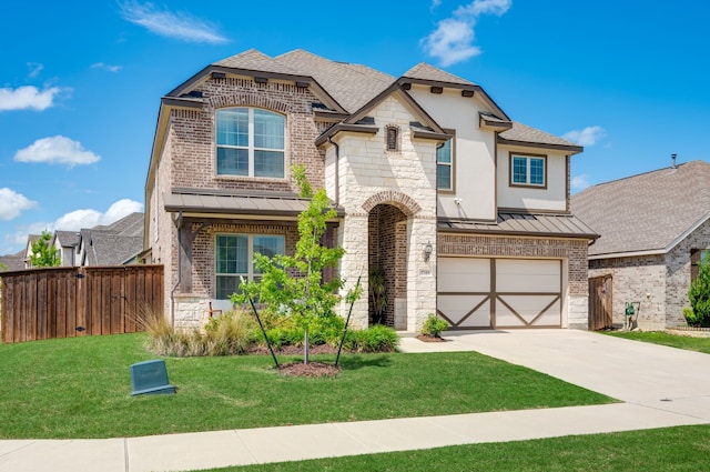1740 Wassel Rd, Fort Worth, TX 76052 - french country home featuring a standing seam roof, concrete driveway, a garage, and roof with shingles