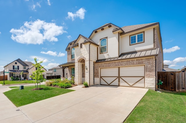 1740 Wassel Rd, Fort Worth, TX 76052 - view of front of property with brick siding, driveway, an attached garage, a standing seam roof, and stone siding