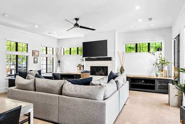living room featuring visible vents, recessed lighting, ceiling fan, and a fireplace