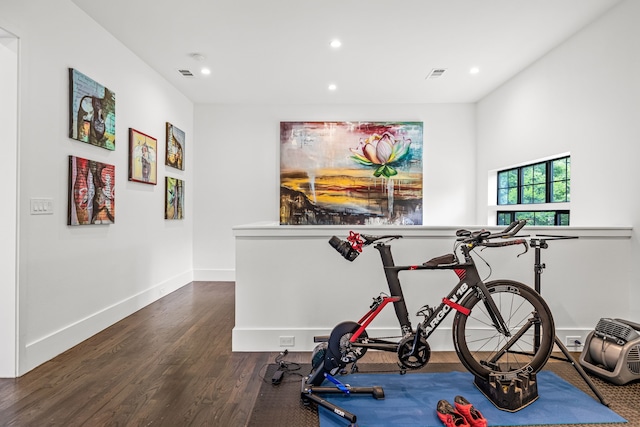 workout area featuring baseboards, recessed lighting, visible vents, and dark wood-style flooring