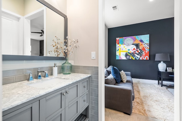 bathroom with a ceiling fan, visible vents, and vanity