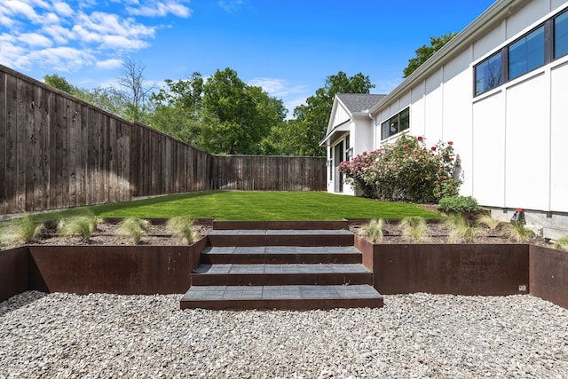 view of yard with a fenced backyard