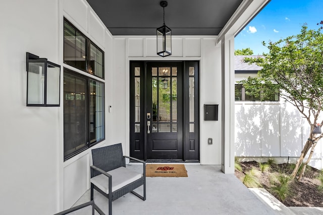 doorway to property featuring covered porch