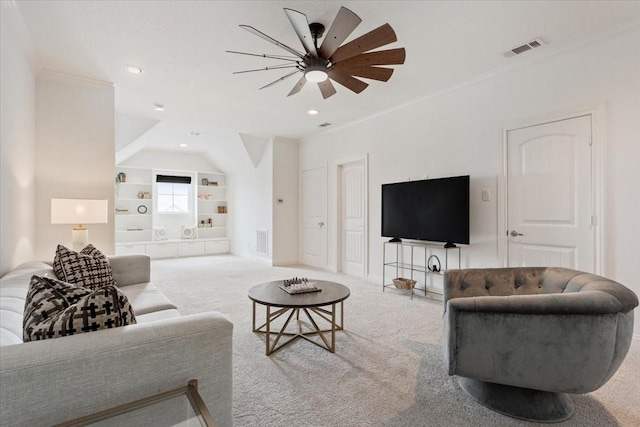 carpeted living area with built in shelves, crown molding, a ceiling fan, and visible vents