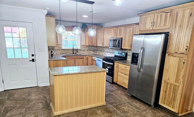 kitchen featuring backsplash, a sink, appliances with stainless steel finishes, and light brown cabinetry