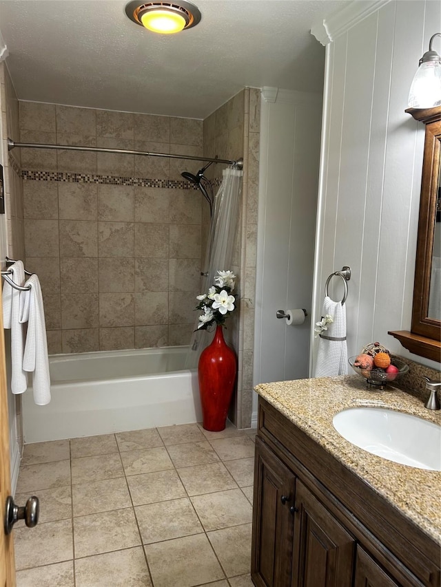 bathroom featuring vanity, tile patterned flooring, and shower / bath combo