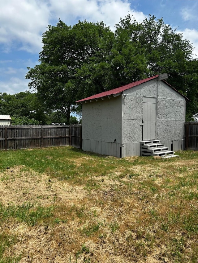 view of outdoor structure with fence