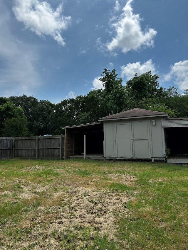 view of yard with fence, an outdoor fire pit, and a patio area
