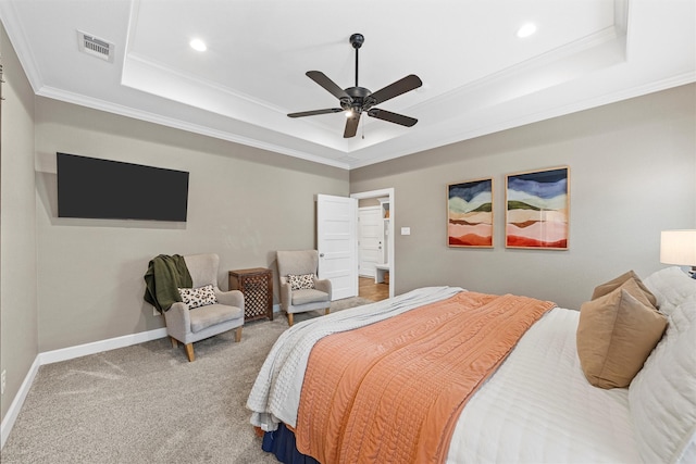bedroom with visible vents, a raised ceiling, carpet, and crown molding