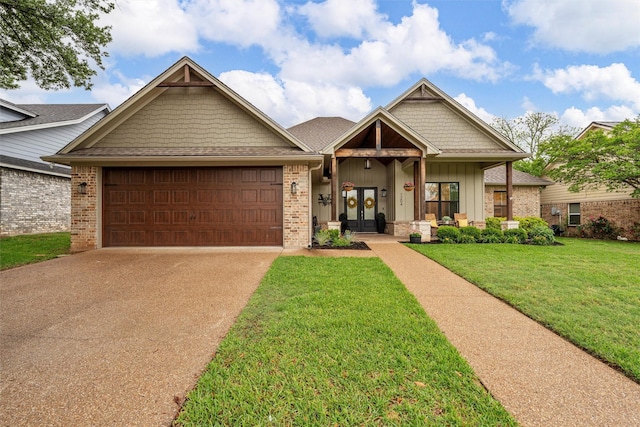 craftsman inspired home with a front lawn, brick siding, concrete driveway, an attached garage, and french doors