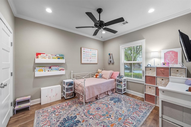bedroom with ornamental molding, recessed lighting, and wood finished floors
