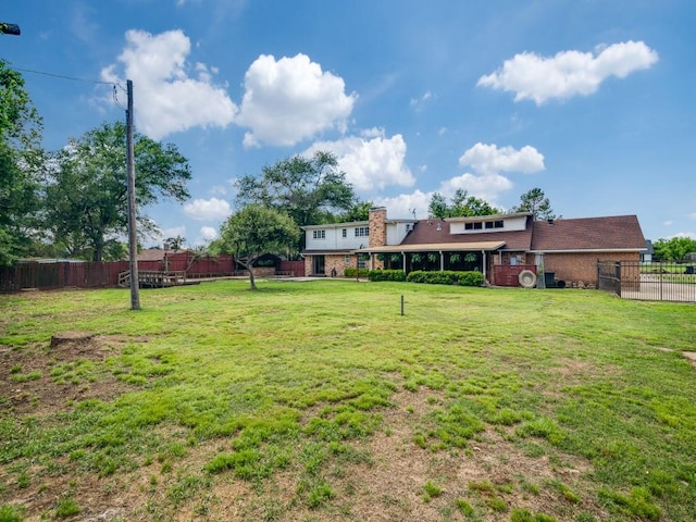 view of yard with a fenced backyard