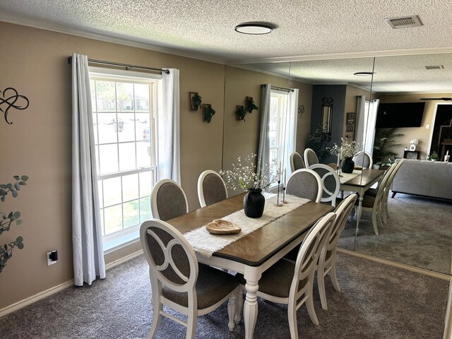 7 Carl Lee Cir, Terrell, TX 75160 - carpeted dining area with a textured ceiling, plenty of natural light, and crown molding