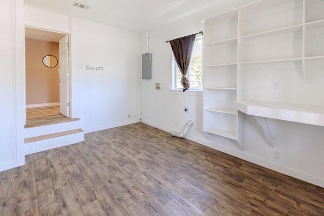 102 S Oak St, Paradise, TX 76073 - unfurnished room with wood finished floors and electric panel