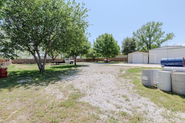 102 S Oak St, Paradise, TX 76073 - view of yard with a garage and an outdoor structure