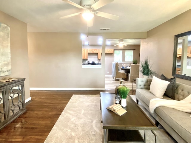 102 S Oak St, Paradise, TX 76073 - living area featuring ceiling fan and dark wood-style flooring