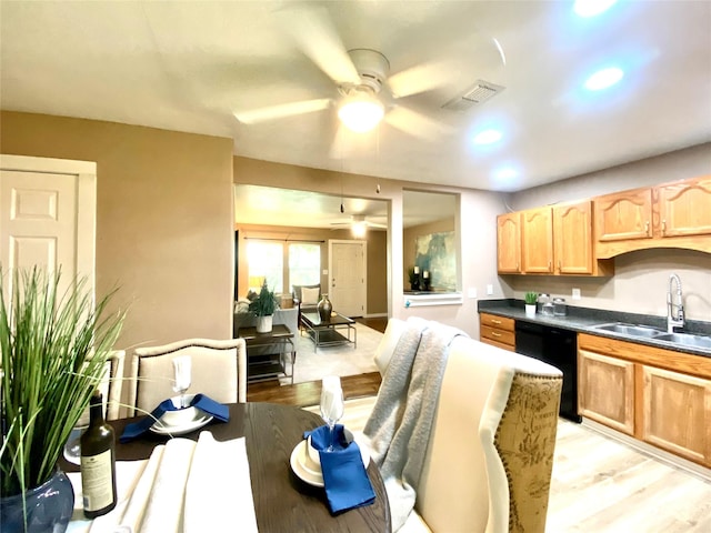 102 S Oak St, Paradise, TX 76073 - kitchen with black dishwasher, a ceiling fan, dark countertops, light wood-style floors, and recessed lighting