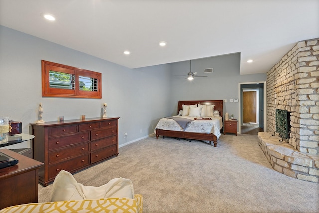 bedroom featuring recessed lighting, light carpet, a fireplace, baseboards, and visible vents