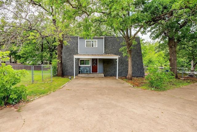 4306 Elmwood Ct, Granbury, TX 76049 - view of front facade featuring a gate, fence, and roof with shingles
