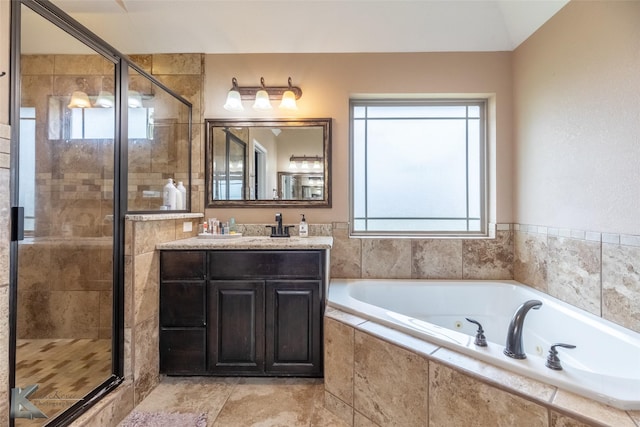 4917 Velta Ln, Abilene, TX 79606 - bathroom with a whirlpool tub, vanity, and a shower stall