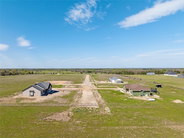 birds eye view of property with a rural view