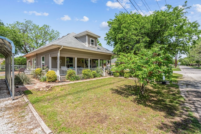 farmhouse inspired home with a front yard and covered porch